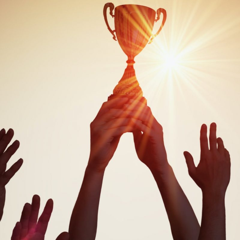 Holding up a trophy